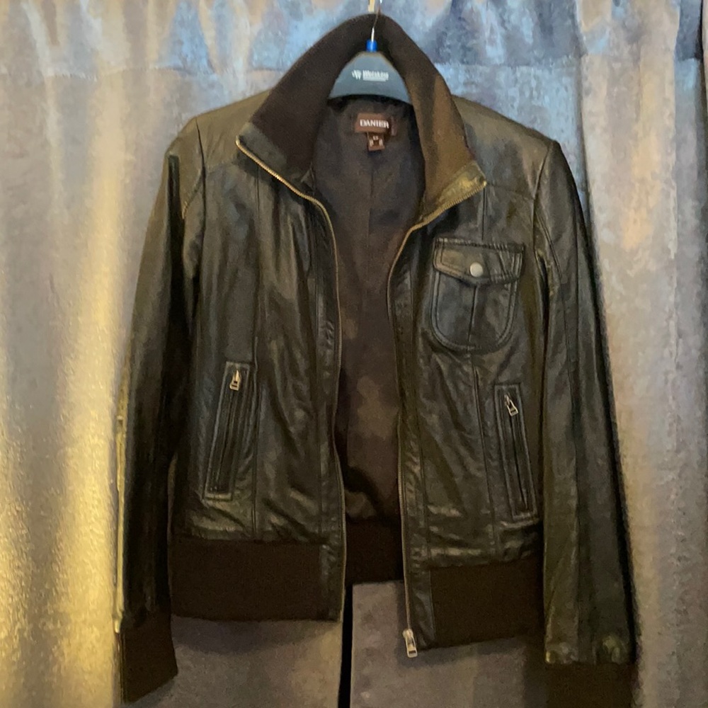 A black leather coat, size small, by Daniel.